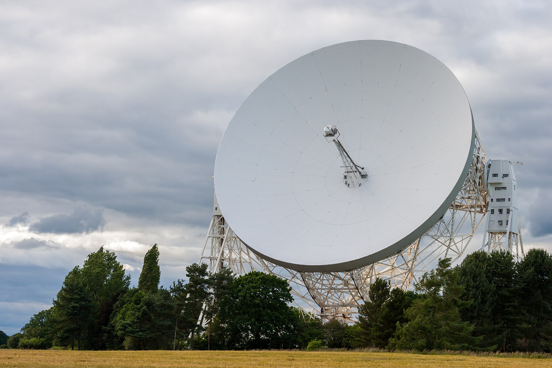 The Lovell radio telescope at Jodrell Bank against a cloudy sky