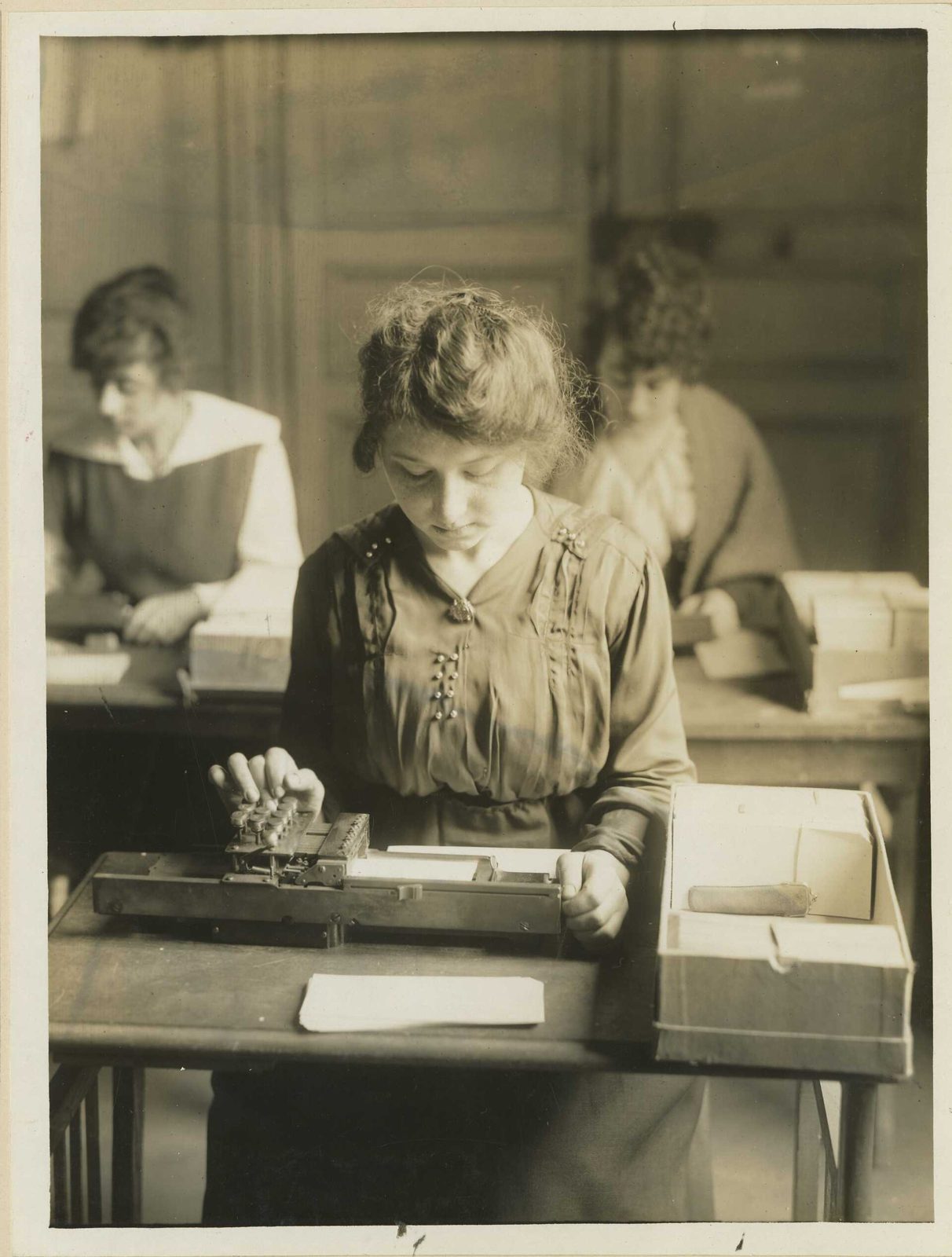 A clerk working a Hollerith punched-card machine